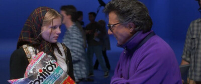 Screencap from a scene from the movie Wag The Dog: At a film stage a fake movie clip from a supposed war is being produced.